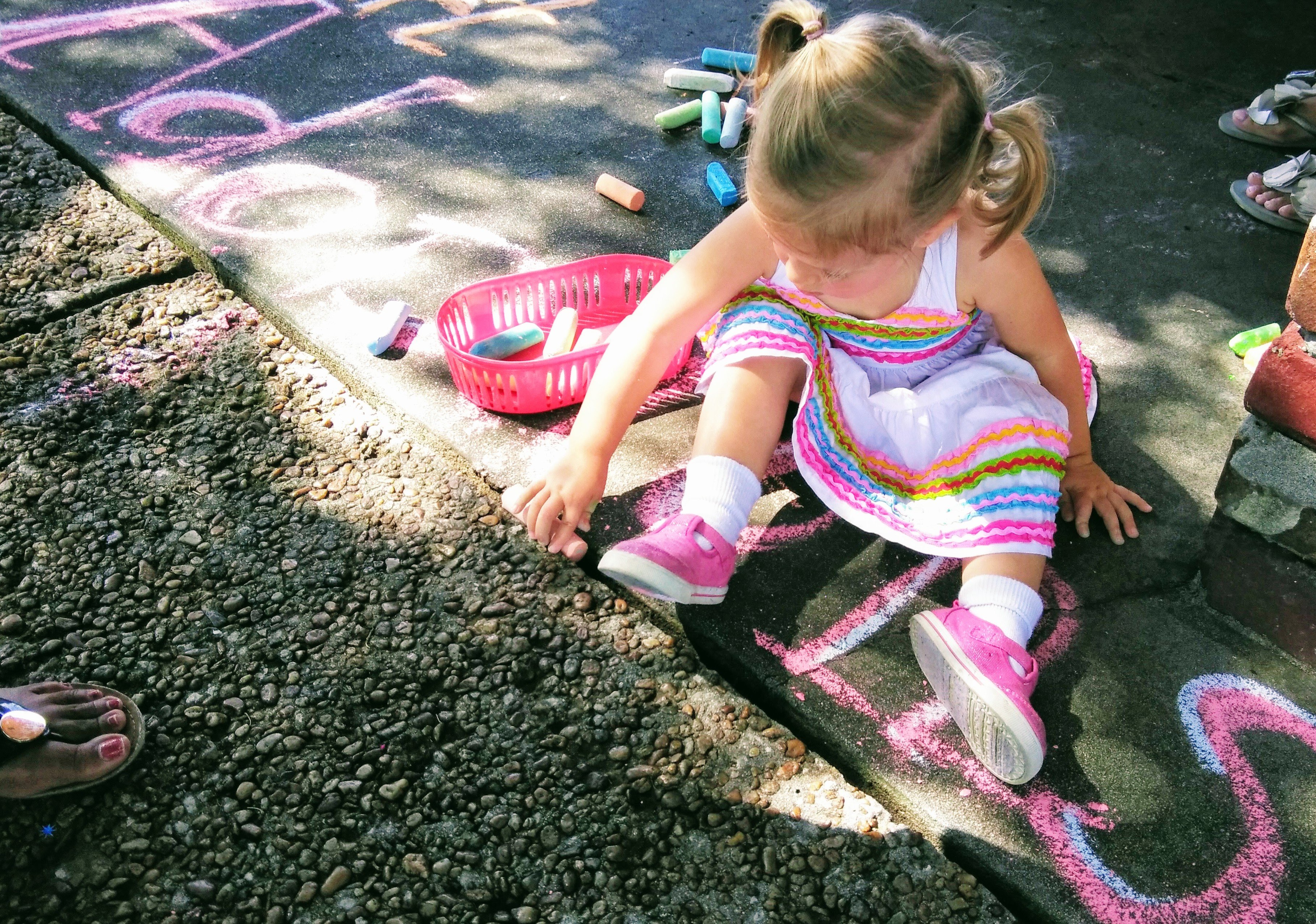 little girl with chalk