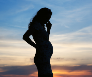 Pregnant woman sunset